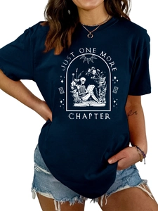 Detail of gothic skeleton reading among flowers print on a dark crew neck T-shirt