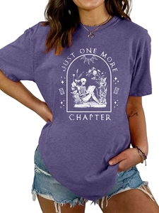 Close-up of Just One More Chapter graphic print on purple cotton t-shirt fabric