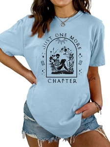 Close-up of light blue T-shirt with skeleton reading books print and vintage lettering