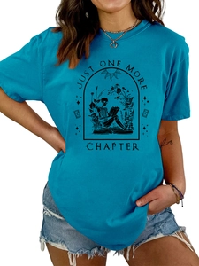 Detail of teal cotton T-shirt featuring a retro skeleton reading illustration with text