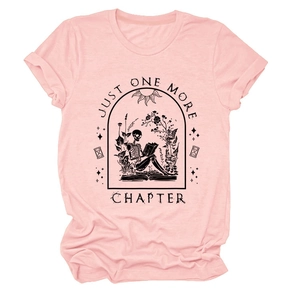 Close-up of skeleton reading book print on pink cotton T-shirt with flower details