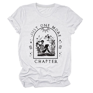 Detailed close-up of Just One More Chapter skull and floral print on white cotton tee
