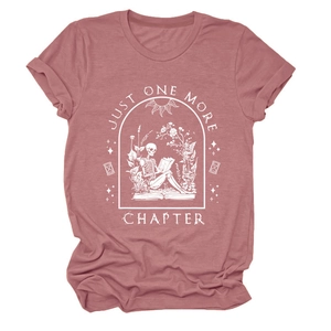 Detail of Just One More Chapter print on dusty rose t-shirt with skull and floral graphics