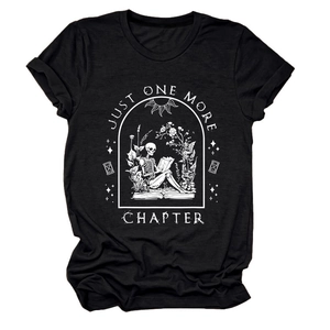 Detail of Just One More Chapter graphic print with skeleton reading in a floral frame