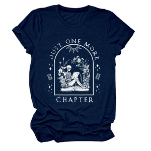 Detail of Just One More Chapter print on navy blue cotton t-shirt with skeleton and flowers