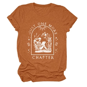 Detail of burnt orange t-shirt featuring a vintage skull reading print and graphic text