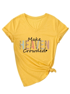 Detail of V-neck yellow T-shirt with 'Make Heaven Crowded' text and side knot detail