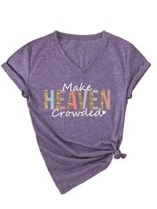 Detail of purple V-neck T-shirt with Make Heaven Crowded print and knotted hem