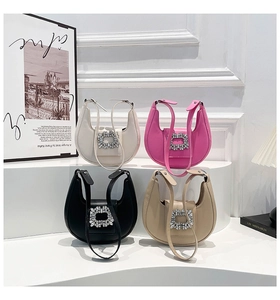 Close-up of crescent shoulder bags with luxury rhinestone buckles in four colors