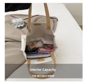 Vertical tote bag interior showing large capacity for iPad and cosmetics on soft fabric