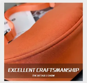 Detailed close-up of precise stitching on an orange nylon crossbody crescent bag