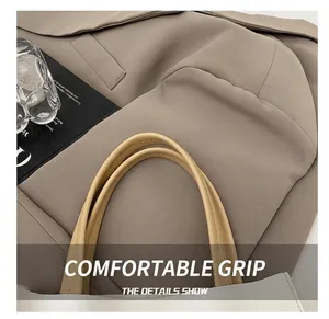 Detailed close-up of premium faux leather tote bag with fine stitching and soft handles