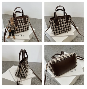Detailed views of a houndstooth handbag with brown leather accents and a cute bunny charm