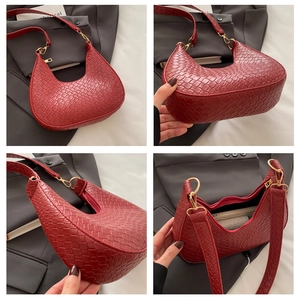 Detailed views of red woven crescent bag showing textures, bottom and interior gold hardware
