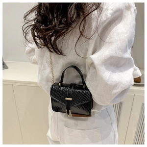 Model view of black snakeskin texture mini square bag with golden chain strap