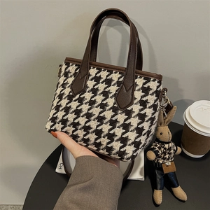 Classic houndstooth small tote bag with brown leather handles and creative bunny charm