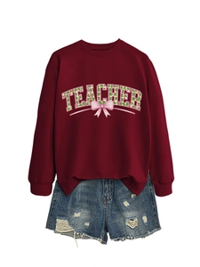 Detail of burgundy Teacher sweatshirt with clover bow print and denim shorts