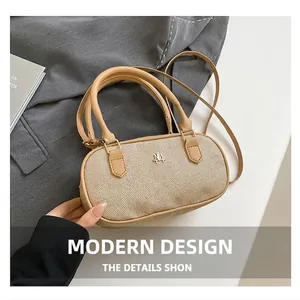 Detailed macro view of beige woven texture and leather strap on this bowling bag