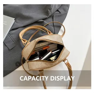 Close-up of interior capacity of the beige woven pillow bag showing makeup essentials