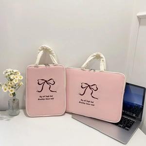 Pink canvas laptop sleeve with red bow embroidery for students in two various sizes