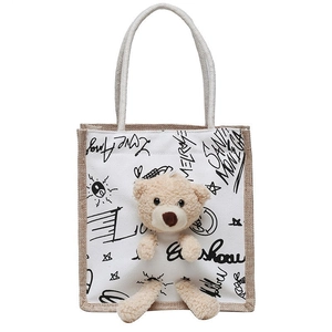 Minimalist canvas tote bag with 3D teddy bear and stylish graffiti prints on white background