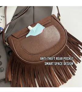 Detail of brown vintage tassel saddle bag with matte finish and back anti-theft pocket