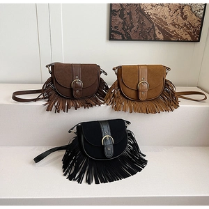 Retro bohemian saddle bags with long tassels in dark brown, caramel and black tones