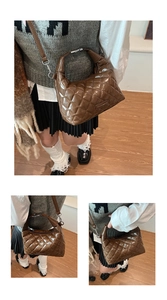 Close-up of brown quilted patent leather handbag with glossy finish and logo detail