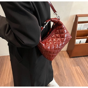 Polished wine red quilted shoulder bag with glossy finish and silver metal hardware