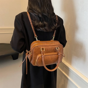 Retro brown PU leather multi-functional backpack with gold hardware and dual handles