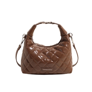 Brown quilted faux leather handbag with top handle and detachable shoulder strap