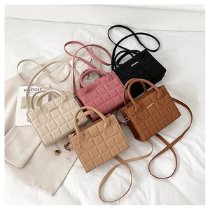 Detailed overhead view of quilted crossbody handbags in five stylish assorted colors