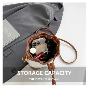 Capacity view of quilted bucket bag containing phone, lipstick and perfume items