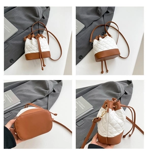 Detail view of mini quilted bucket bag featuring a drawstring closure and leather base