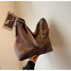 Brown vintage suede hobo bag with leather patchwork and adjustable strap details