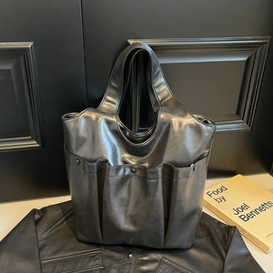 Minimalist black large capacity PU leather tote bag with three decorative front pockets