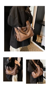 Detail of dark brown leather tote featuring multiple zippers and vintage metal charms