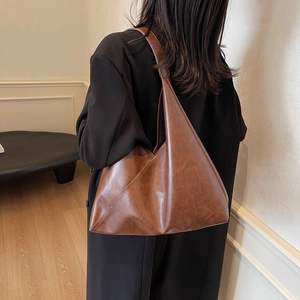Brown minimalist large capacity shoulder bag with matte texture for daily commuting wear