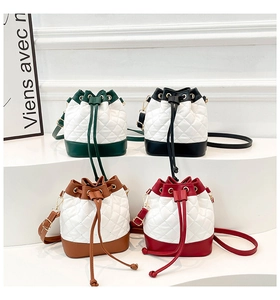Quilted drawstring bucket bags in four contrast colors with gold chain straps