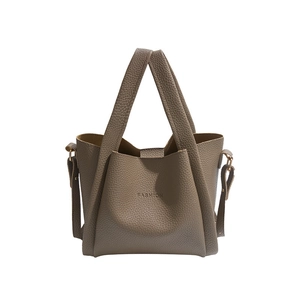 Grey lychee pattern leather bucket bag with top handle and adjustable shoulder strap