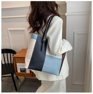 Detail view of the colorful PU leather tote bag with shoulder straps and metal buckle