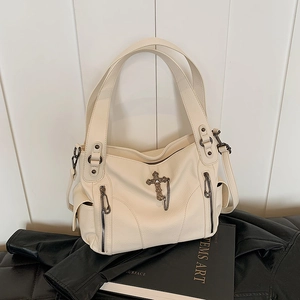 Chic beige oversized tote bag with vintage gothic cross and pebble leather texture