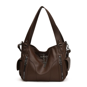 Retro dark brown pebbled leather tote bag with metallic cross and chain fringe detail