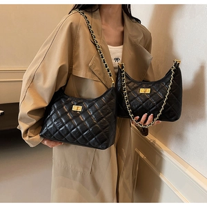 Comparison of large and small black quilted tote bags with gold chains and twist locks