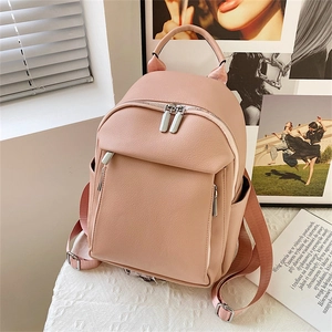 Pink lychee texture leather backpack for women with dual zippers and side pockets
