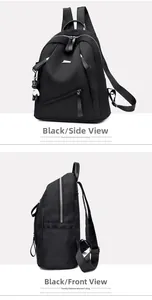 Detail view of black large capacity nylon backpack with silver zippers and bear keychain