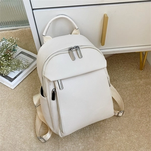 Minimalist creamy white faux leather backpack for women with silver zippers and lychee texture