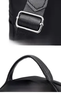 Detail of adjustable silver buckle strap and ergonomic leather handle on black backpack