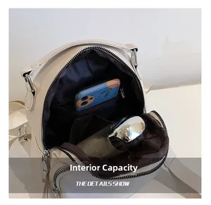 Interior view of off-white backpack showing spacious main compartment and pockets