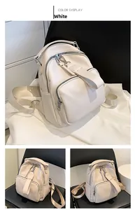 Front and side views of white litchi pattern PU leather backpack with nylon straps